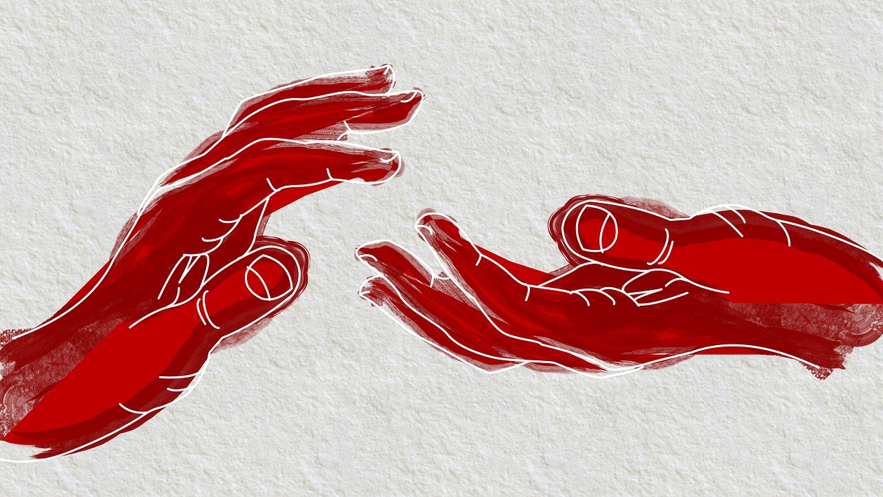 Two red silhouette hands reaching out to help