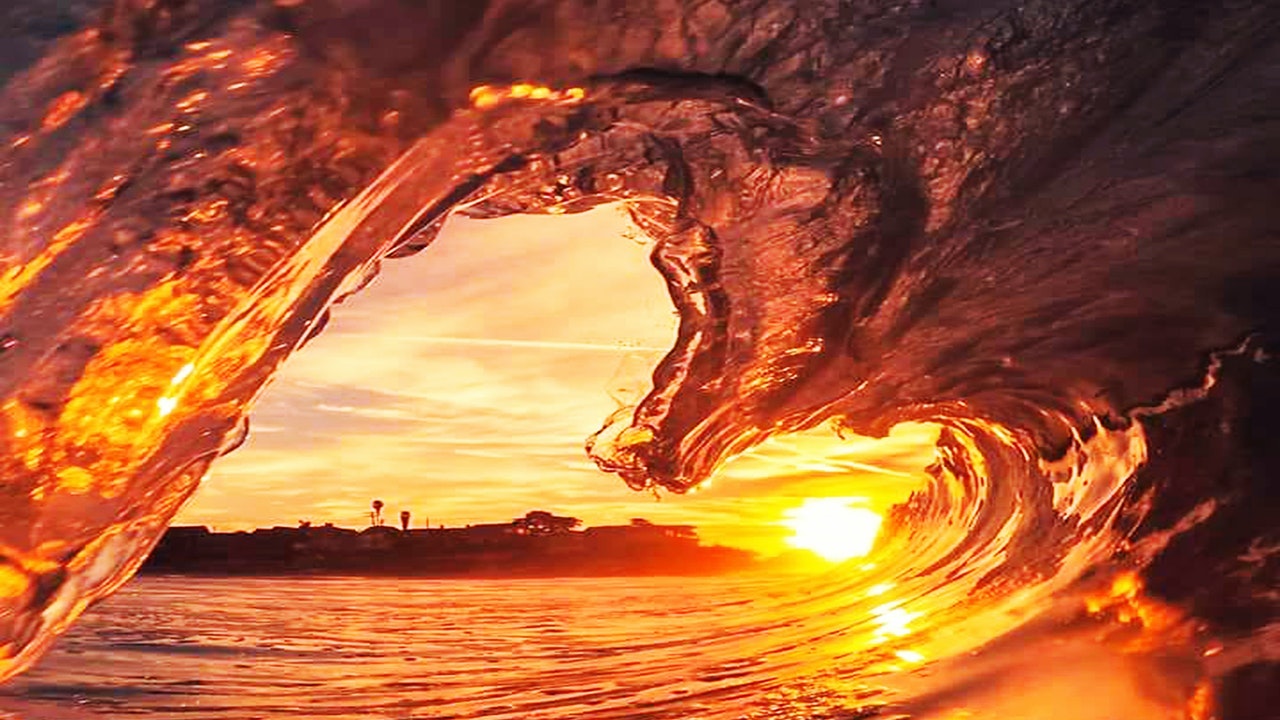 Huge Waves forming a Heart doorway against the sunlight.