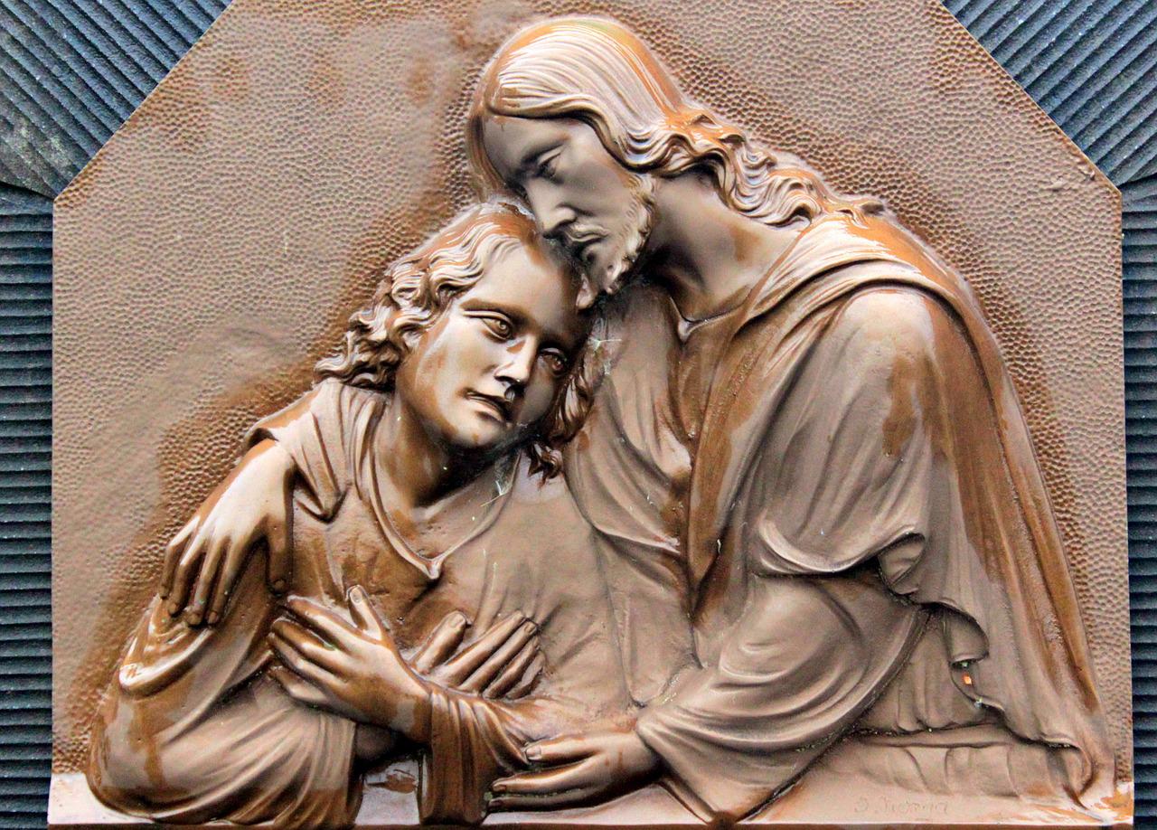 Sculpure of Jesus comforting child.
