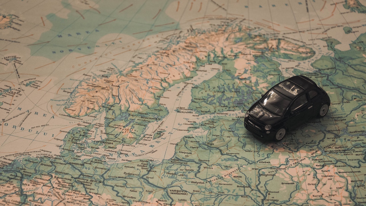 Black Toy Car on World Map